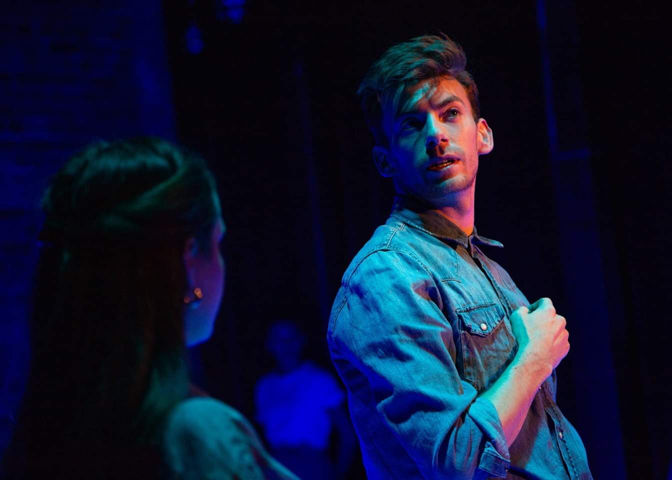 Fraser performing on stage